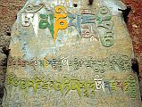 207 Kagbeni Mani Stone The ancient Bon religion gave way to Buddhism, symbolized by this mani stone in Kagbeni, with the most famous mantra Om Mani Padme Hum.